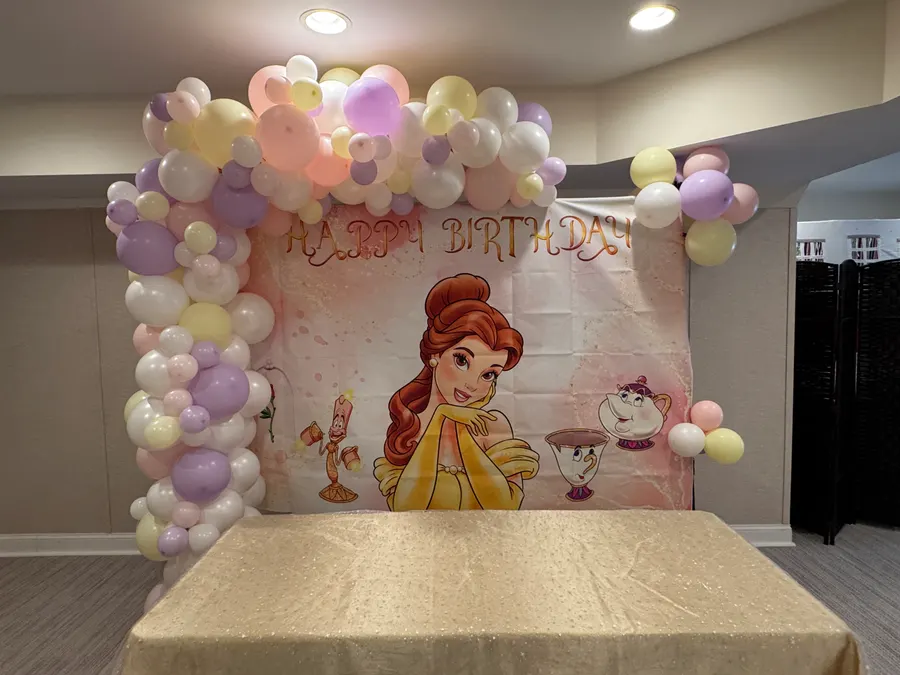 Beauty and the Beast themed birthday balloon garland and backdrop
