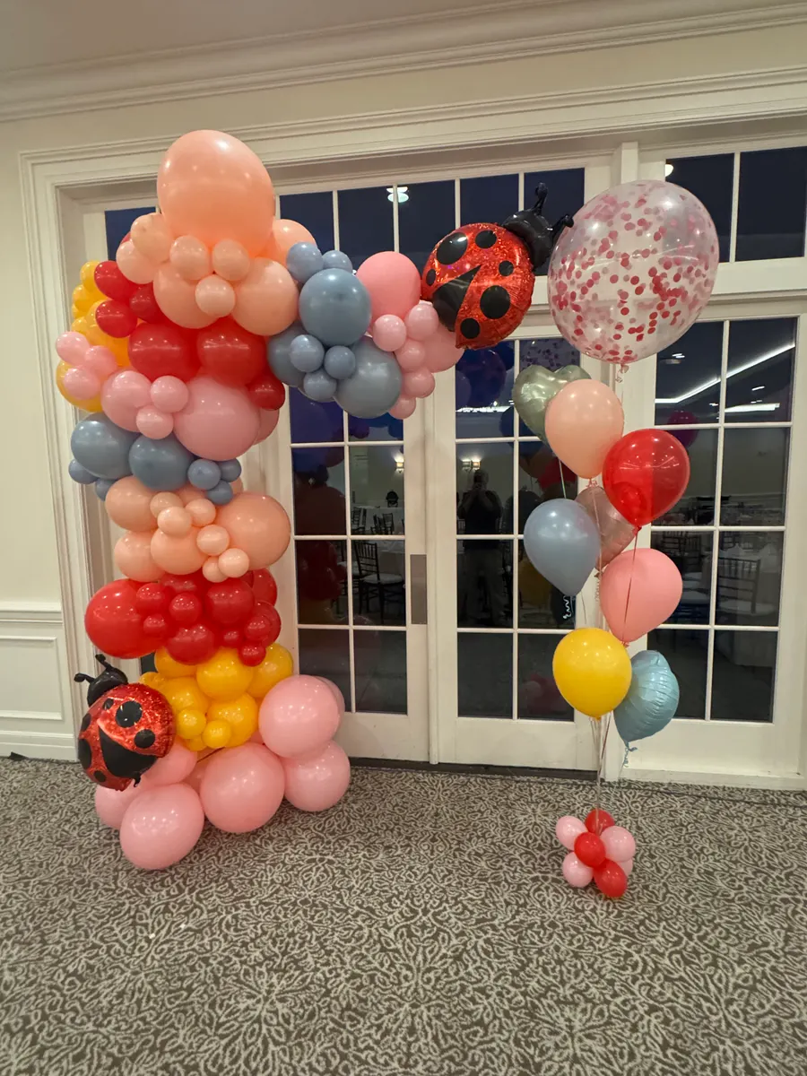 Ladybug-themed organic balloon column