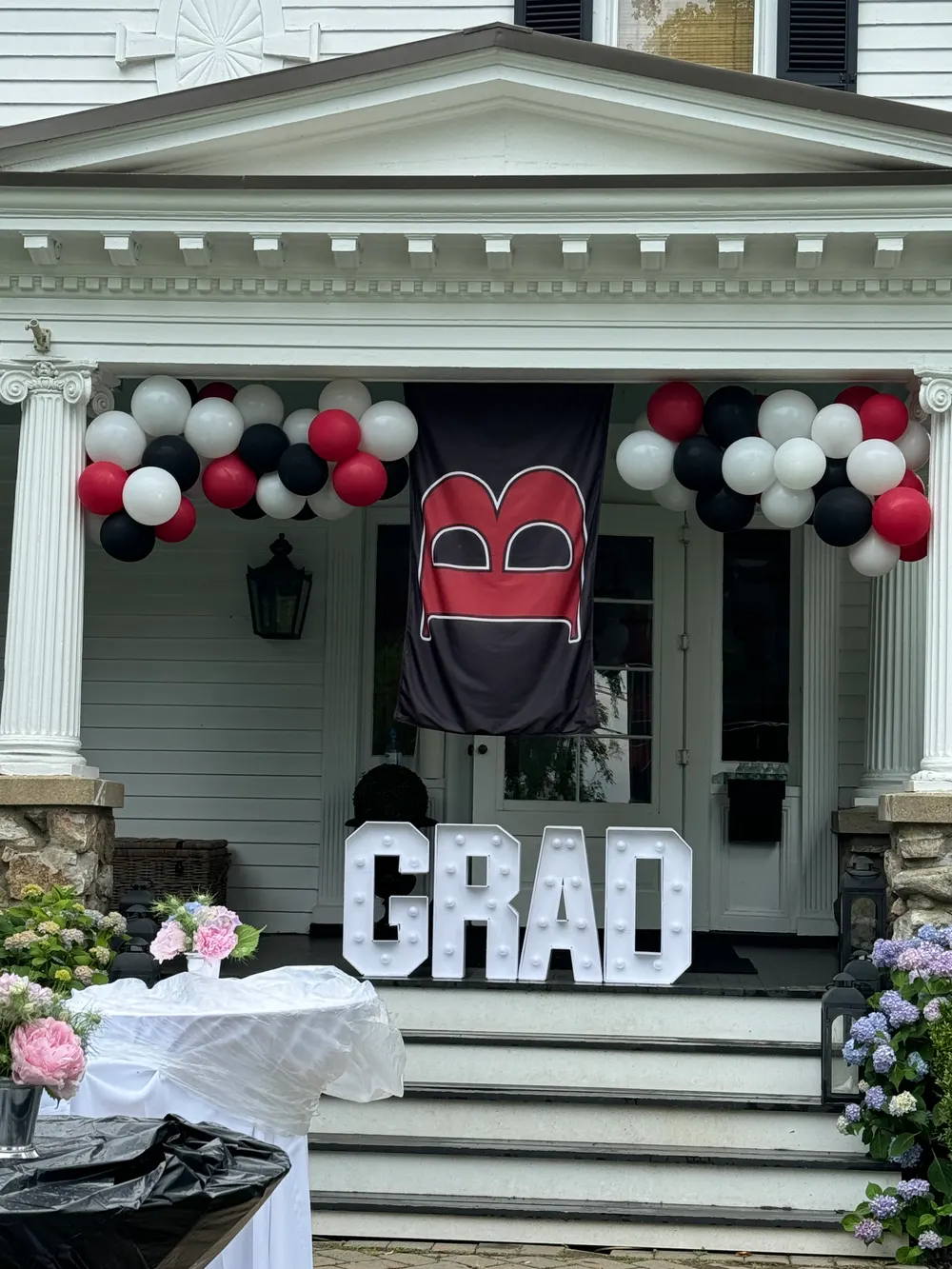Graduation balloon garland and GRAD marquee letters