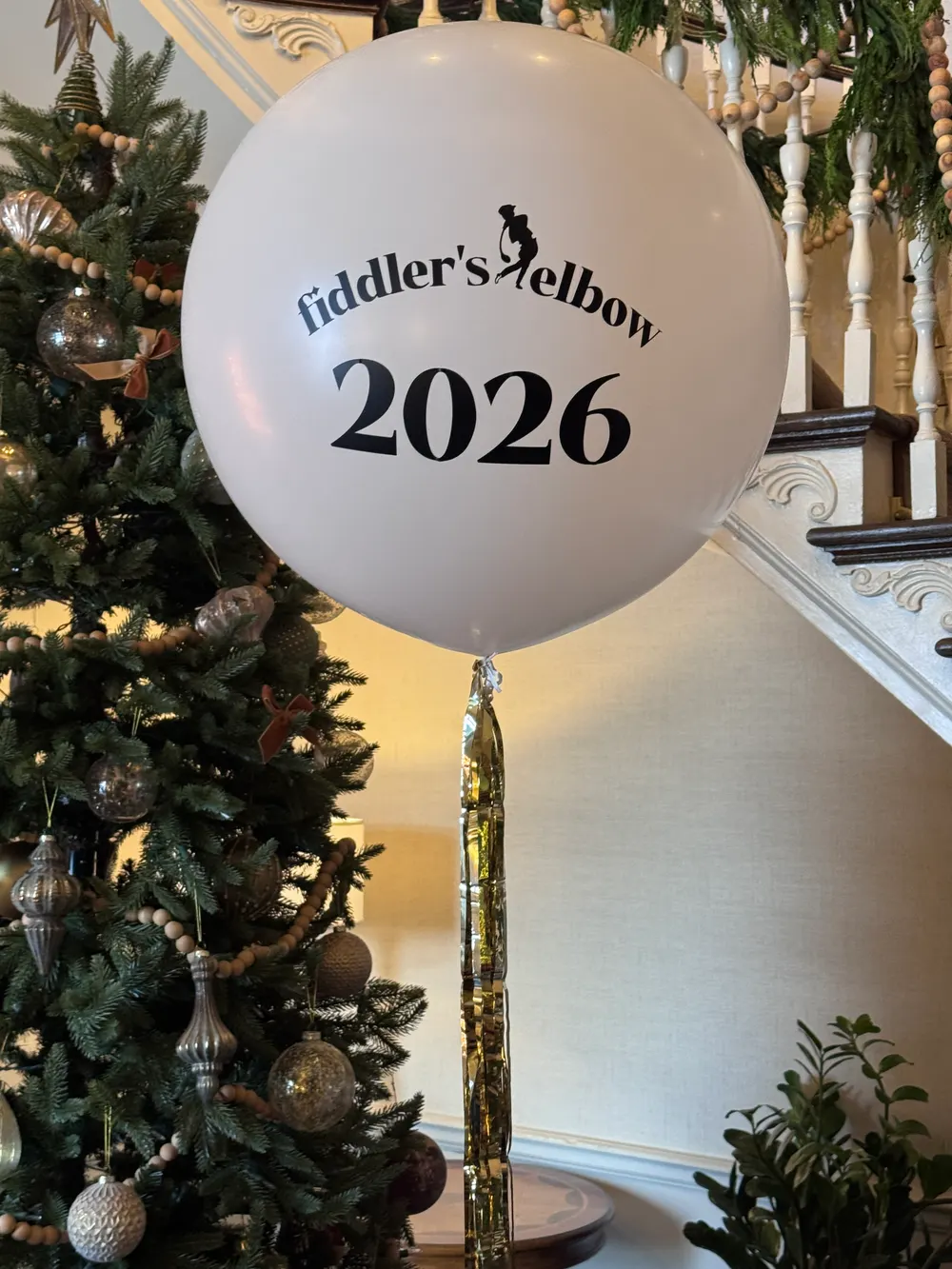 Giant custom printed balloon with a tassel tail